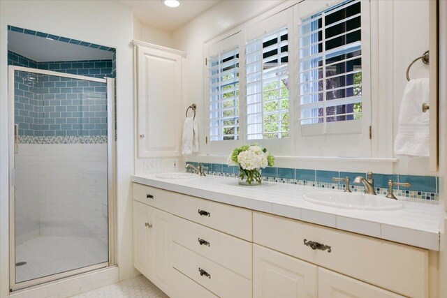 2509 Spring Ln, Austin, TX 78703 - full bathroom featuring a shower stall and double vanity