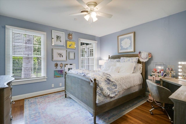 2509 Spring Ln, Austin, TX 78703 - bedroom featuring wood finished floors, baseboards, and ceiling fan