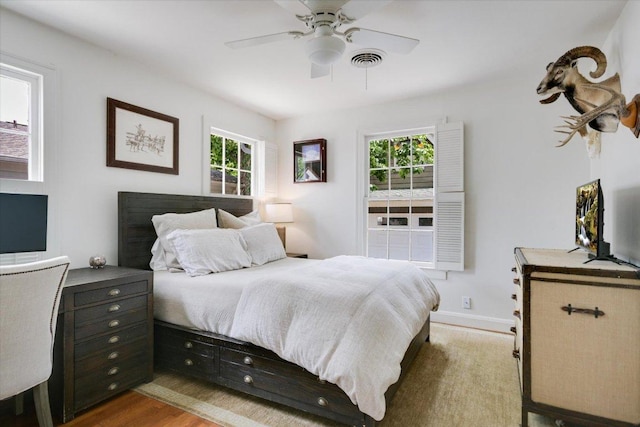 2509 Spring Ln, Austin, TX 78703 - bedroom featuring wood finished floors and a ceiling fan