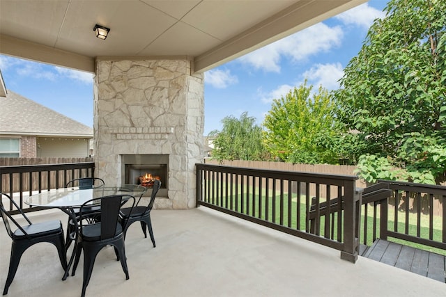 21105 Huckabee Bnd, Pflugerville, TX 78660 - view of patio with an outdoor stone fireplace and outdoor dining area