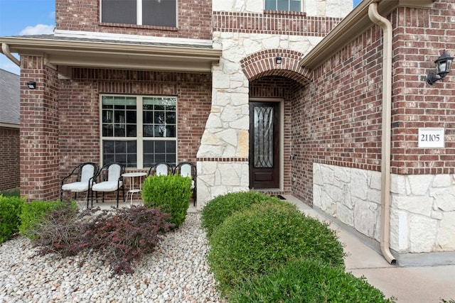 21105 Huckabee Bnd, Pflugerville, TX 78660 - property entrance featuring brick siding and stone siding