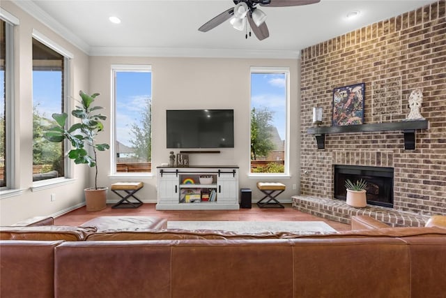 562 Stone River Dr, Austin, TX 78737 - living room with wood finished floors, a ceiling fan, a fireplace, ornamental molding, and recessed lighting
