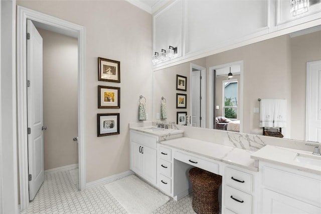 562 Stone River Dr, Austin, TX 78737 - full bath with double vanity, ensuite bathroom, tile patterned floors, and baseboards