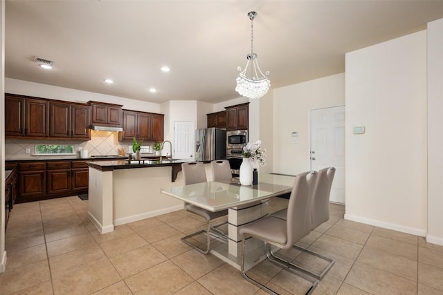 112 Bearing Cv, Austin, TX 78717 - dining space with light tile patterned floors, a chandelier, recessed lighting, and baseboards