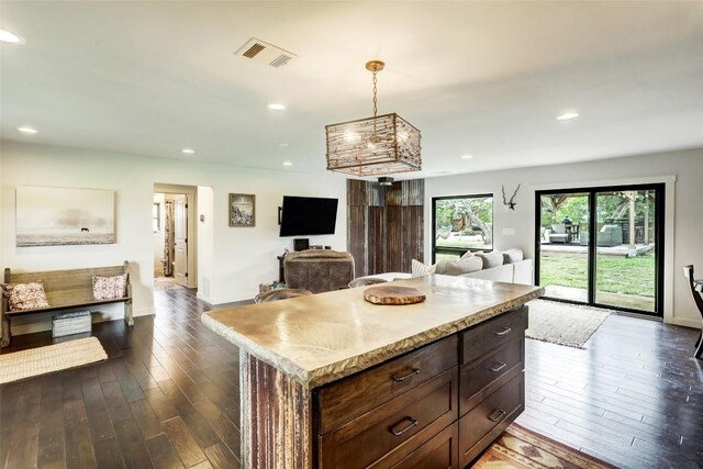 11700 Rim Rock Trl, Austin, TX 78737 - kitchen featuring open floor plan, dark wood-style floors, a kitchen island, light countertops, and recessed lighting