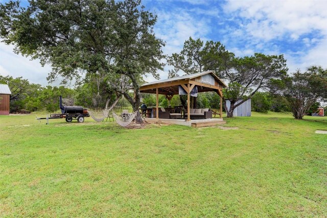 11700 Rim Rock Trl, Austin, TX 78737 - view of grassy yard featuring a gazebo, an outdoor living space, and an outbuilding