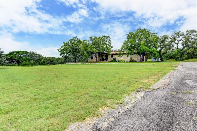 11700 Rim Rock Trl, Austin, TX 78737 - view of front facade with a front lawn