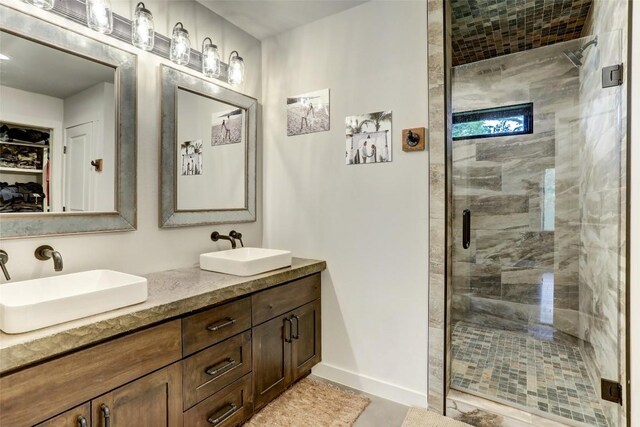 11700 Rim Rock Trl, Austin, TX 78737 - bathroom featuring double vanity and a shower stall