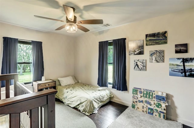 11700 Rim Rock Trl, Austin, TX 78737 - bedroom featuring dark wood finished floors and ceiling fan