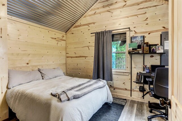 11700 Rim Rock Trl, Austin, TX 78737 - bedroom with wooden walls, wood finished floors, vaulted ceiling, and wood ceiling