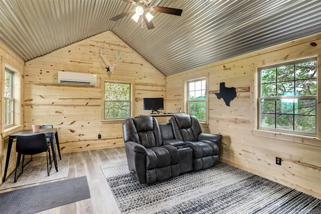 11700 Rim Rock Trl, Austin, TX 78737 - living room featuring a wall mounted air conditioner, vaulted ceiling, wood walls, ceiling fan, and wood finished floors