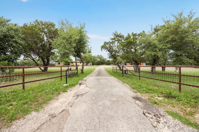 11700 Rim Rock Trl, Austin, TX 78737 - view of asphalt driveway featuring a rural view