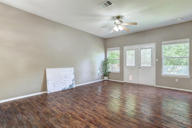 1003 E 3rd St, Georgetown, TX 78626 - unfurnished room featuring ceiling fan, wood finished floors, baseboards, and a smoke detector