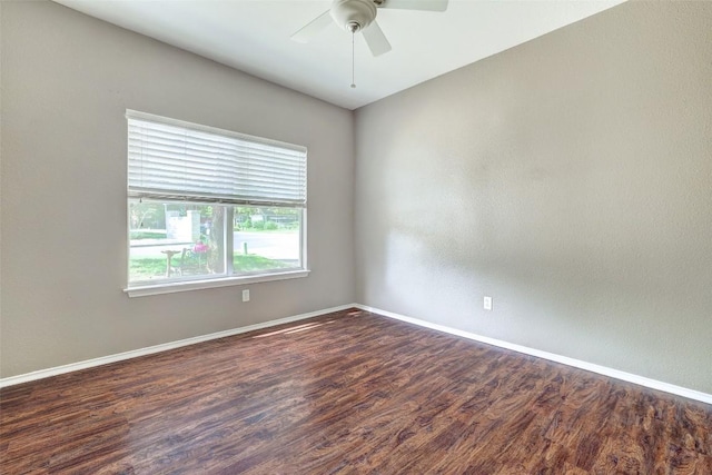 1003 E 3rd St, Georgetown, TX 78626 - unfurnished room with a ceiling fan, wood finished floors, and baseboards