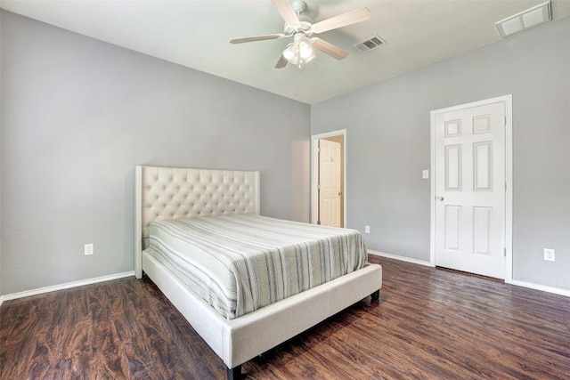 1003 E 3rd St, Georgetown, TX 78626 - bedroom featuring baseboards, wood finished floors, and ceiling fan