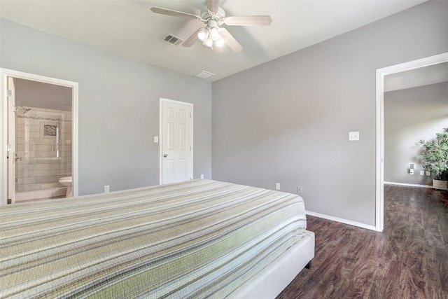 1003 E 3rd St, Georgetown, TX 78626 - bedroom with wood finished floors, baseboards, ensuite bath, and a ceiling fan
