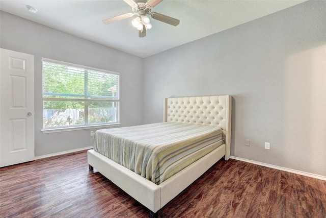 1003 E 3rd St, Georgetown, TX 78626 - bedroom with baseboards, wood finished floors, and ceiling fan