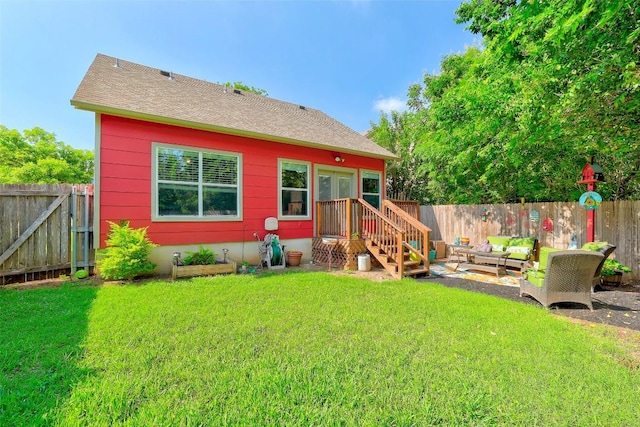 1003 E 3rd St, Georgetown, TX 78626 - back of property with an outdoor hangout area and roof with shingles