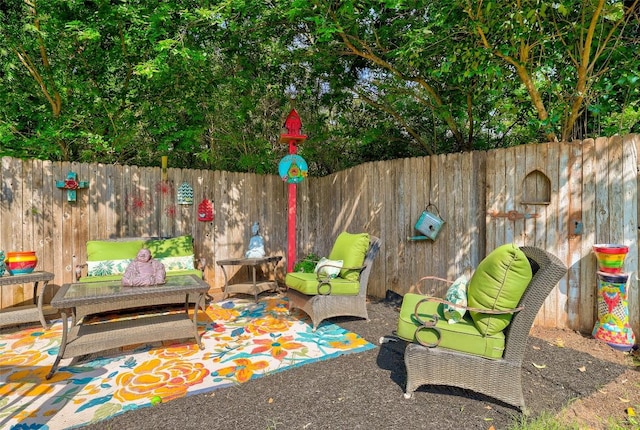 1003 E 3rd St, Georgetown, TX 78626 - fenced backyard with a patio and an outdoor living space