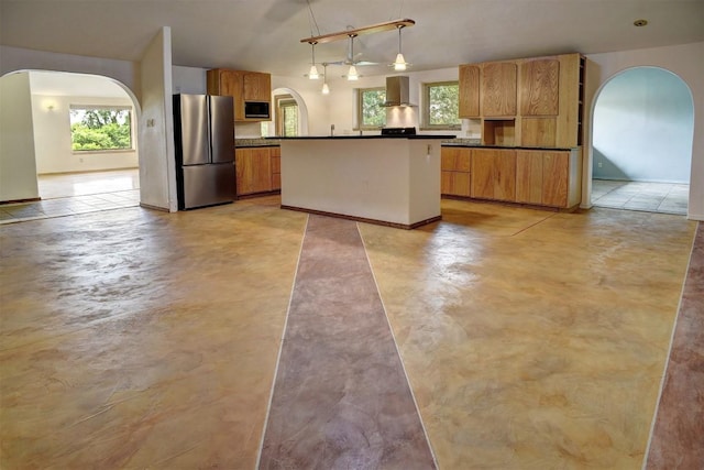 123 Konahuanui Ln, Bastrop, TX 78602 - kitchen featuring freestanding refrigerator, arched walkways, wall chimney exhaust hood, and black microwave