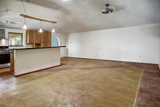 123 Konahuanui Ln, Bastrop, TX 78602 - kitchen featuring range with gas cooktop, finished concrete flooring, dark countertops, wall chimney exhaust hood, and hanging light fixtures
