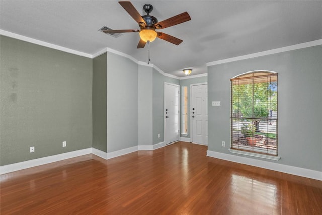 1011 Moser River Dr, Leander, TX 78641 - unfurnished room with wood finished floors, a ceiling fan, baseboards, and ornamental molding