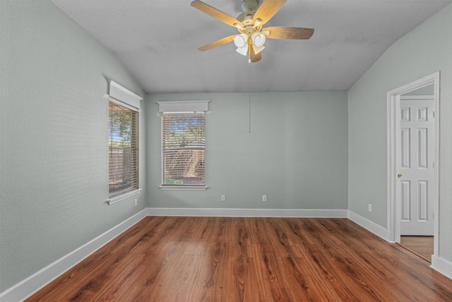 1011 Moser River Dr, Leander, TX 78641 - spare room with lofted ceiling, wood finished floors, ceiling fan, and baseboards
