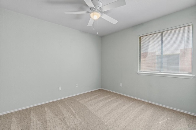 1011 Moser River Dr, Leander, TX 78641 - spare room featuring carpet flooring, a ceiling fan, and baseboards