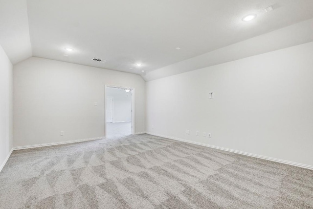1905 Mariann Dr, Leander, TX 78641 - spare room with vaulted ceiling, carpet floors, and recessed lighting