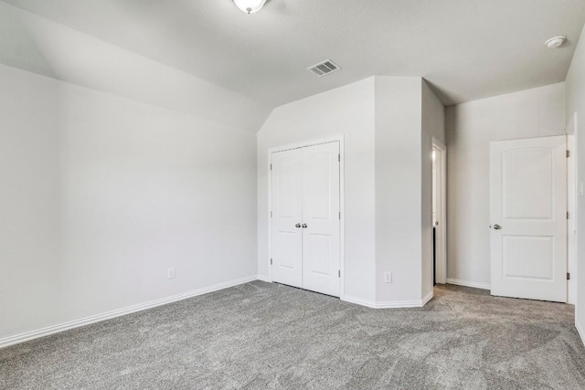 1905 Mariann Dr, Leander, TX 78641 - unfurnished bedroom with carpet floors, a closet, and lofted ceiling