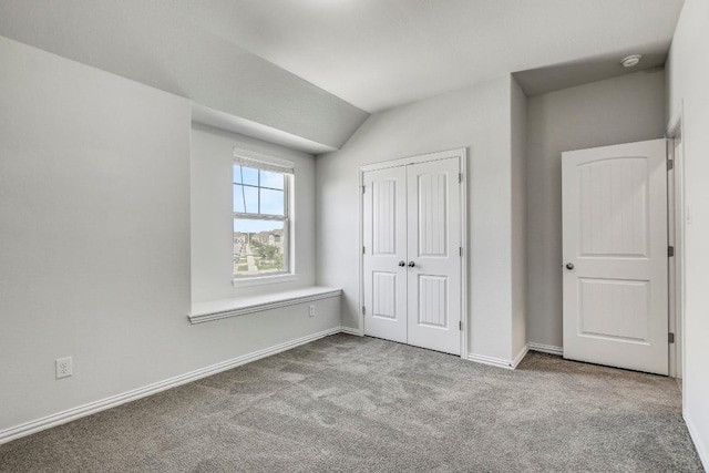 1905 Mariann Dr, Leander, TX 78641 - unfurnished bedroom featuring carpet floors, vaulted ceiling, and a closet