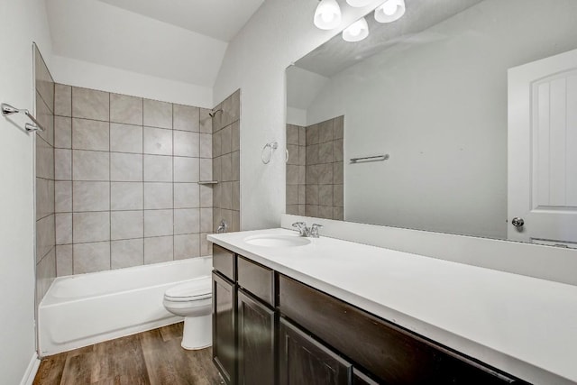 1905 Mariann Dr, Leander, TX 78641 - full bath featuring wood finished floors, vanity, and washtub / shower combination