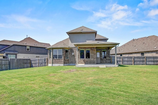 1905 Mariann Dr, Leander, TX 78641 - rear view of property featuring a patio area, a fenced backyard, brick siding, and a shingled roof