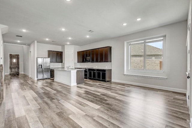 1905 Mariann Dr, Leander, TX 78641 - unfurnished living room featuring recessed lighting and wood finished floors