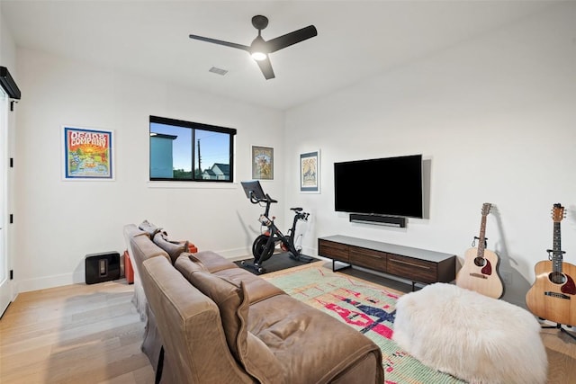 14417 Cochise Trl, Austin, TX 78734 - living area featuring light wood-style floors, a ceiling fan, and baseboards