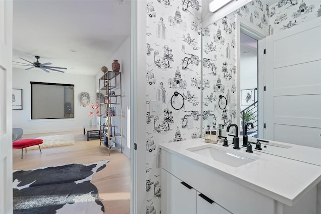 14417 Cochise Trl, Austin, TX 78734 - bathroom with wood finished floors, vanity, and ceiling fan