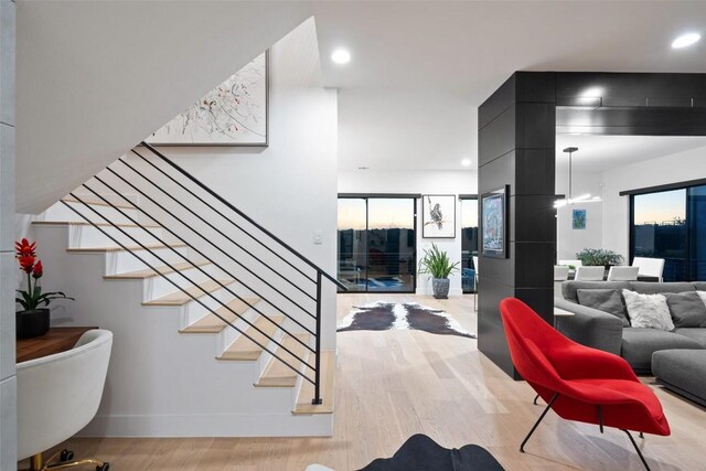 14417 Cochise Trl, Austin, TX 78734 - stairs with wood finished floors, recessed lighting, and baseboards