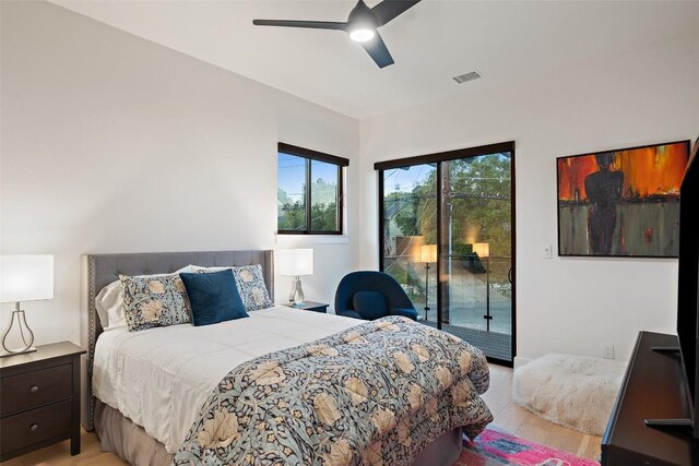 14417 Cochise Trl, Austin, TX 78734 - bedroom featuring access to exterior, light wood-style floors, and a ceiling fan