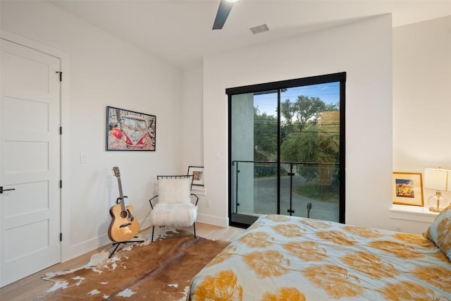 14417 Cochise Trl, Austin, TX 78734 - bedroom with access to exterior, wood finished floors, ceiling fan, and baseboards