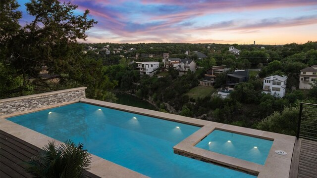 14417 Cochise Trl, Austin, TX 78734 - pool at dusk with an outdoor pool
