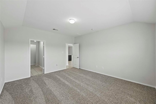 146 Blair Ct, San Marcos, TX 78666 - unfurnished bedroom with vaulted ceiling, light colored carpet, and connected bathroom