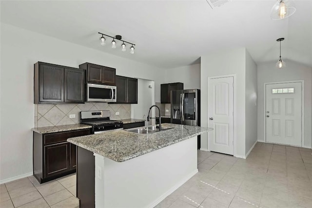 146 Blair Ct, San Marcos, TX 78666 - kitchen with stainless steel appliances, tasteful backsplash, pendant lighting, light tile patterned floors, and light stone countertops