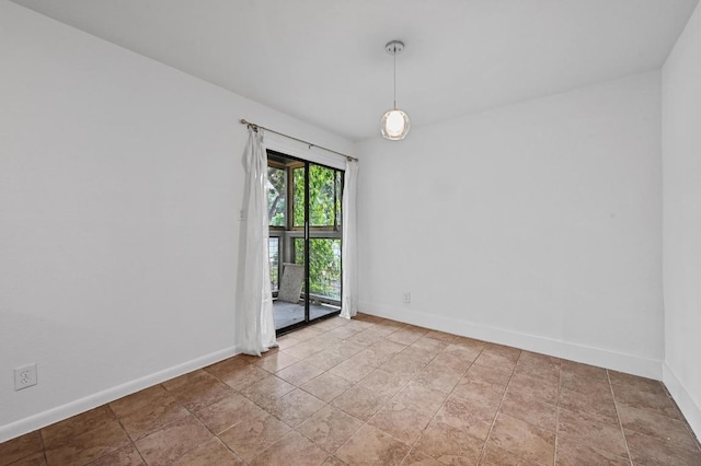 2303 E E Side Dr Unit 102, Austin, TX 78704 - spare room featuring baseboards