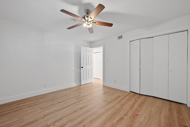 2303 E E Side Dr Unit 102, Austin, TX 78704 - unfurnished bedroom featuring light wood finished floors, a closet, and ceiling fan