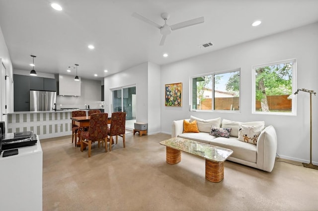 1001 Walter St Unit 2, Austin, TX 78702 - living room with finished concrete floors, recessed lighting, and a ceiling fan