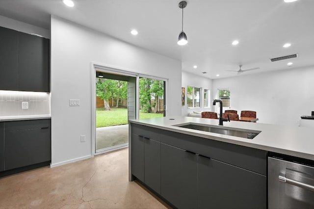 1001 Walter St Unit 2, Austin, TX 78702 - kitchen featuring stainless steel dishwasher, finished concrete flooring, light countertops, decorative light fixtures, and recessed lighting
