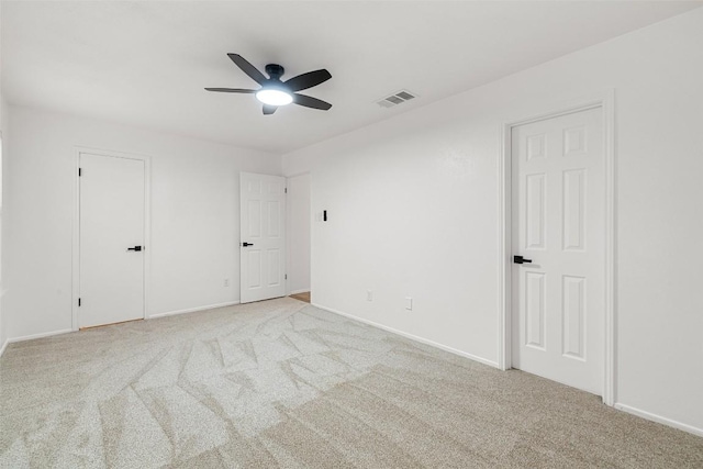 2205 Thornwild Pass, Austin, TX 78758 - unfurnished bedroom featuring light carpet and a ceiling fan