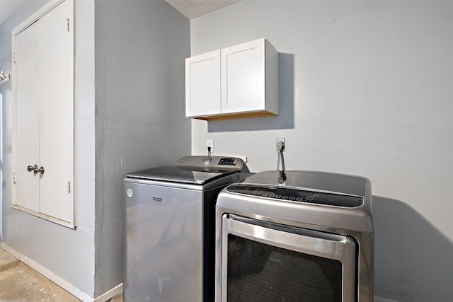 2205 Thornwild Pass, Austin, TX 78758 - laundry area featuring cabinet space and washer and dryer