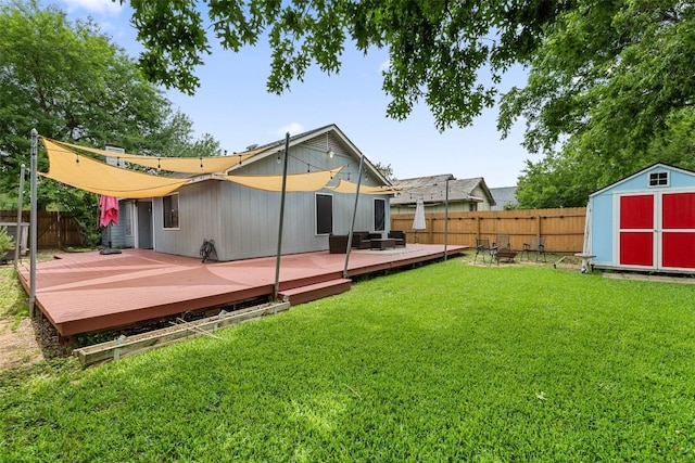 2205 Thornwild Pass, Austin, TX 78758 - rear view of house with a storage unit, a fenced backyard, and a deck