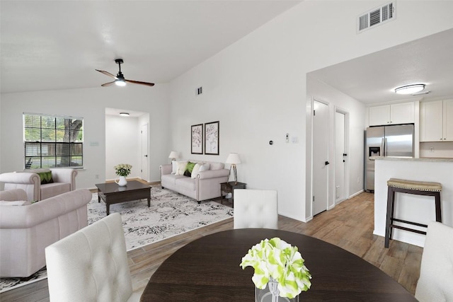 2205 Thornwild Pass, Austin, TX 78758 - living room featuring light wood-style floors, vaulted ceiling, and a ceiling fan